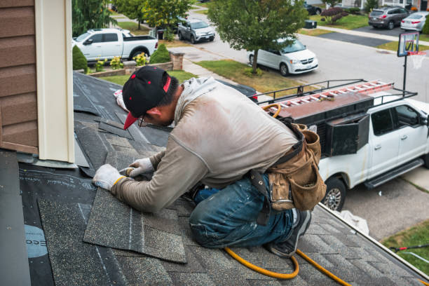Professional Roofing technician working in Cutchogue, NY